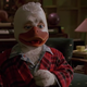 Howard the Duck trying to make his move on Beverly in pajamas and a flannel bathrobe.